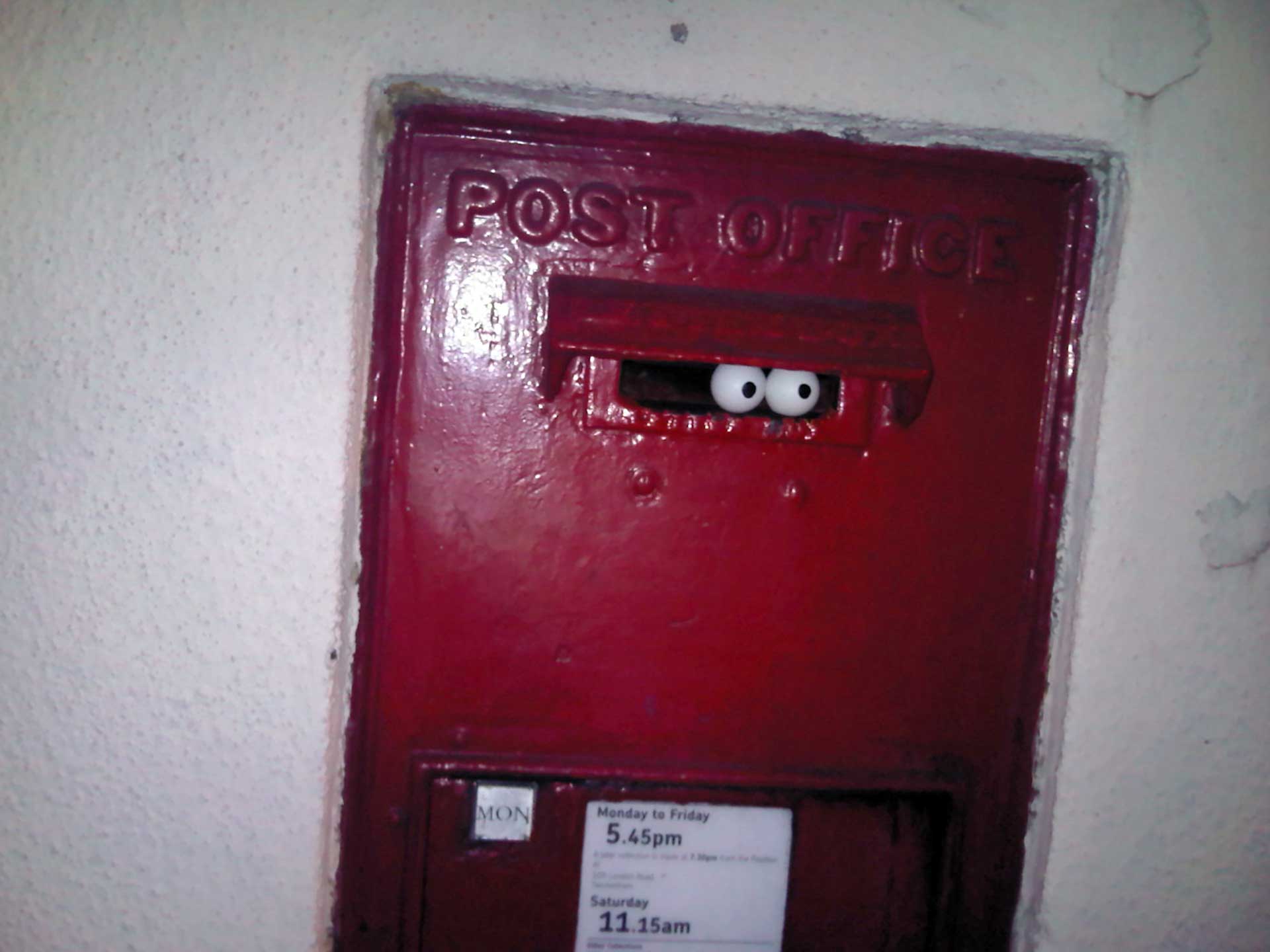 public-eye-urban-intervention-eyes-looking-out-of-british-post-box